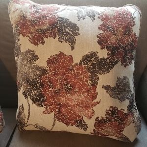 Four decorative pillows in floral print